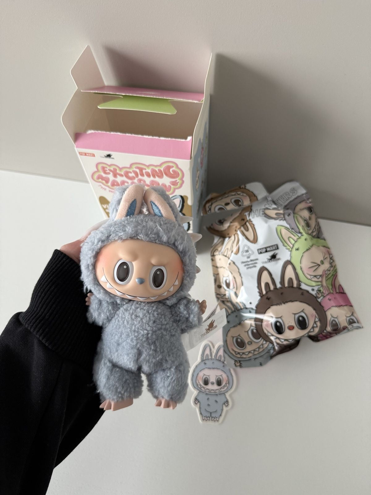 Plush toy with packaging on a white surface